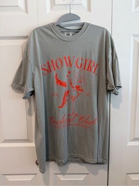 Comfort Colors Sage Green Showgirl Cocktail Club Graphic Tee with Orange Print